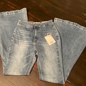Size 7/27 KanCan light wash flare jeans. Brand new with tags.